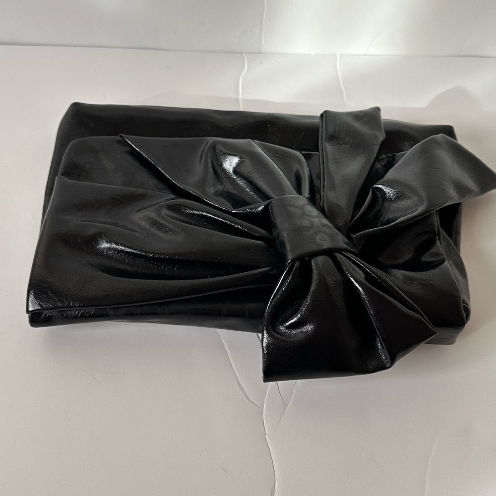 Very simple none leather clutch with bow
